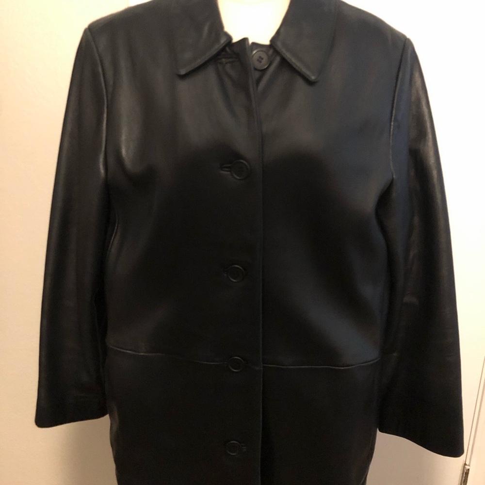 Soft buttery black leather jacket. Button front, side slit pocket. Size L
